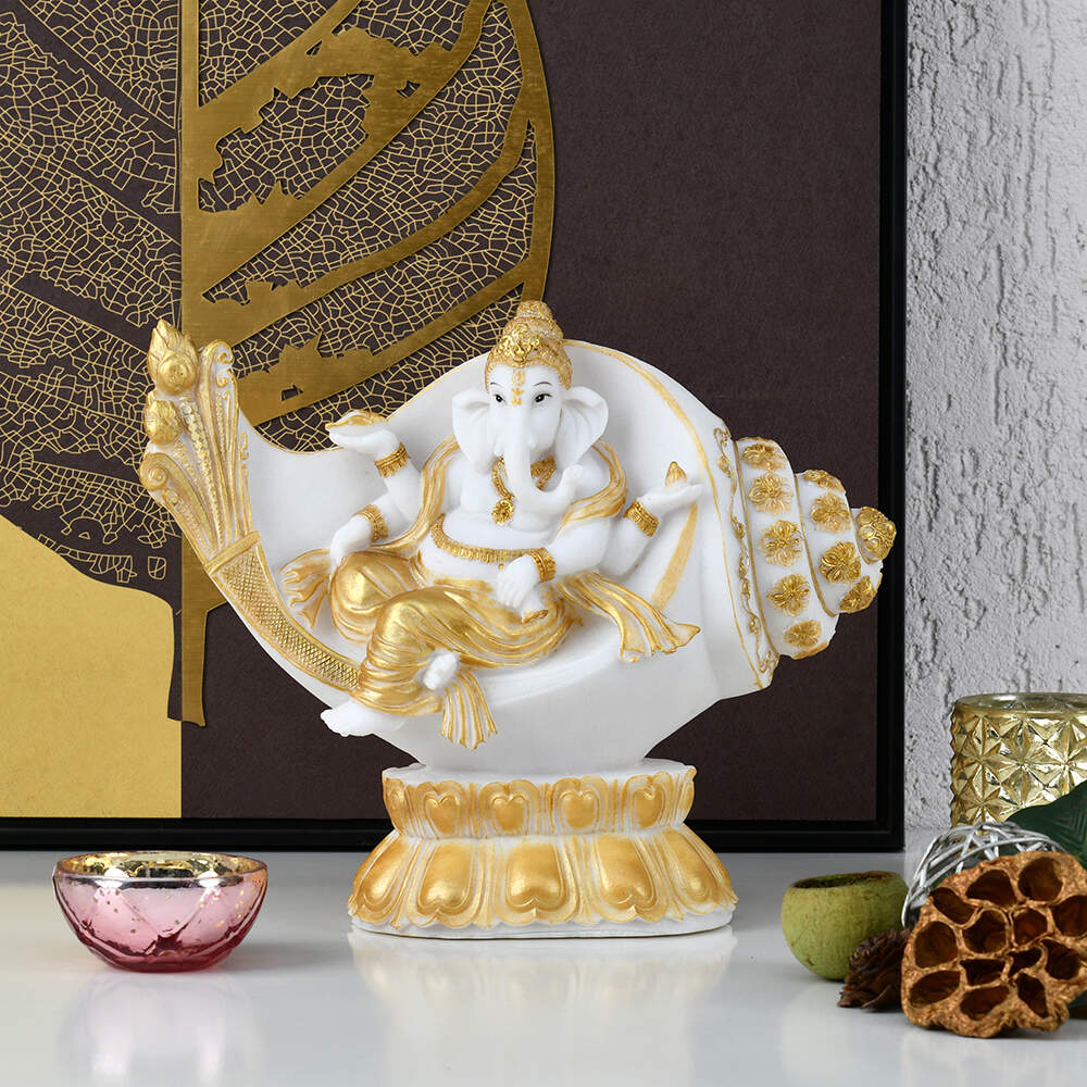 Ganesha On Shankh Polyresin Showpiece (White & Gold)