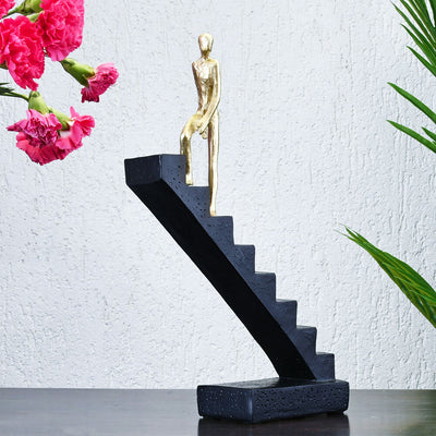 Man Climbing Stairs Decorative Polyresin Showpiece (Black & Gold)