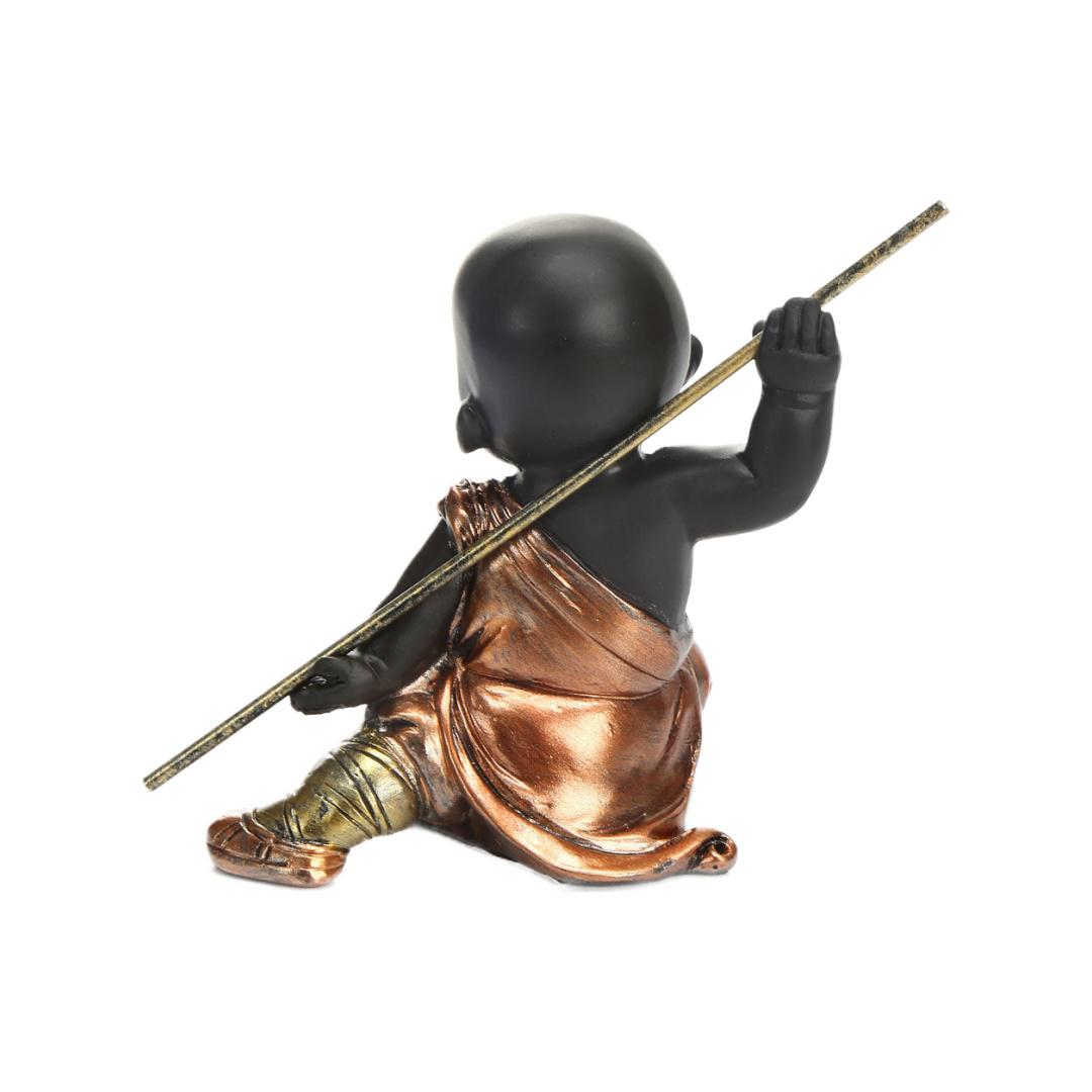 Baby Monk Holding Stick Polyresin Showpiece (Brown)